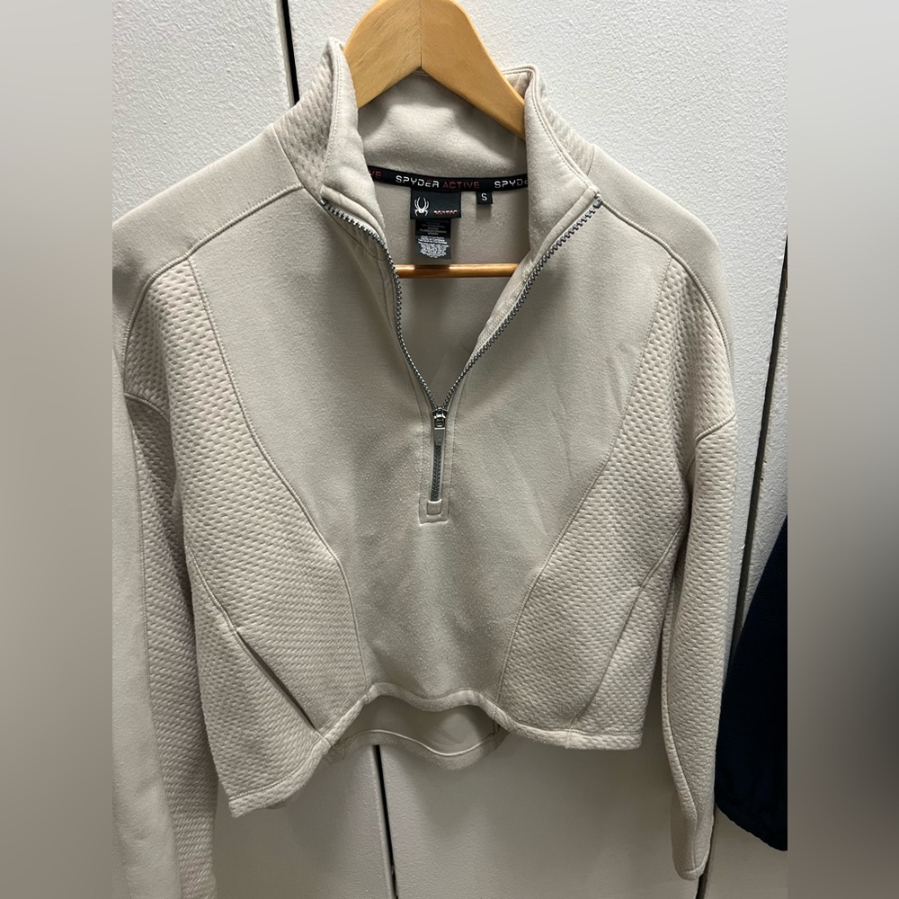 Spyder cropped quarter zip. Size Small. Color cream/tan.